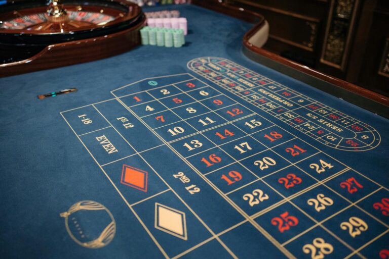 Luxurious casino setting with a roulette table ready for high-stakes gaming sessions.